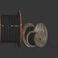 Wooden Cable Reels With Black Cables In Various Sizes On Dark Background
