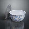 Ceramic Bowl with Blue and White Floral Pattern and Gray Lid on Black Shiny Surface
