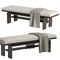 Modern Bed Bench With Light Upholstered Seat Dark Wooden Legs And Gray Throw Blanket