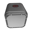 Black Textured Portable Electronic Device With Red Circular Component And Sleek Design