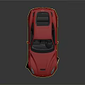 Red Sports Car With Sleek Design Black Interior Silver Wheels And Reflective Surface