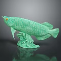 Green Fish Sculpture With Detailed Scales Yellow Eyes And Wave Base Design
