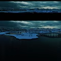 Mountain Scenery with Snowy Peaks Frozen Water Pier and Cloudy Sky at Dusk