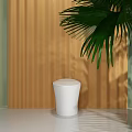 White Smart Toilet in Modern Bathroom with Yellow Curtain and Palm Leaves