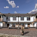 Traditional Chinese Boutique Guesthouse With White Walls Black Tiled Roof And Stone Paved Courtyard