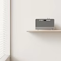 Modern Wooden Wireless Speaker With Retro Design On Shelf Near Window