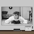 Wall Mounted TV Displaying Classic Black And White Portrait With Wooden Stand And Devices