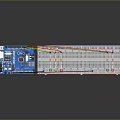 Breadboard With Colored Wires LED Lights And Electronic Circuit Board Prototype