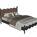 Single Bed Featuring Brown Leather Scalloped Headboard Black Metal Frame Pillows and Patterned Quilt