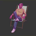 Man Sitting On Orange Folding Chair Wearing Yellow T Shirt Blue Jeans And White Shoes