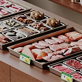 Various Raw Meat Cuts Displayed in Metal Trays with Price Tags on Wooden Counter