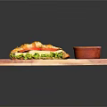 Fresh Croissant Sandwich With Lettuce Tomato Cheese And Green Sauce On Wooden Tray