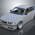 White BMW Two Door Coupe With Lowered Stance And Large Alloy Wheels