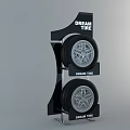 Two Dream Tire Tires Displayed on Black Stand with Brand Logo