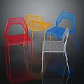 Colorful Modern Mesh Chairs in Red Yellow Blue White with Dark Background Reflection