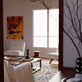 Cozy Living Room Interior With Wooden Beams Stone Fireplace Shelves And White Furniture