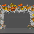 Decorative Flower Arch With Yellow Orange Blooms White Poles And Colorful Small Flowers At Base