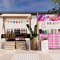 Vibrant Commercial Street With Outdoor Wine Stalls Colorful Banners Handicrafts And Flower Accessories