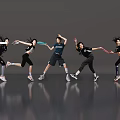 Women Dancing In Athletic Wear With Dynamic Movements Against Gray Background And Shiny Floor