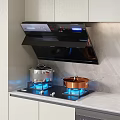 Modern Kitchen Interior With Black Range Hood Gas Stove Blue Flames And Cookware