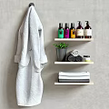 Organized Bathroom Storage Shelves With Bath Products Towels Robe And Small Plant