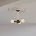 Brass Chandelier With White Spherical Lampshades On White Ceiling With Circular Plaster Moldings And Trim