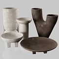 Artisanal Ceramic Vessels in Various Shapes with Textured Surfaces and Neutral Tones