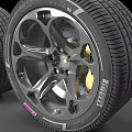 Two Modern Automotive Tires with Alloy Wheels and Detailed Tread Design
