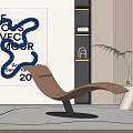 Tan Modern Lounge Chair In Contemporary Interior With Abstract Art And Green Plant