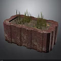Green Grass Like Plants Growing In Red Rectangular Stone Planter With Mottled Texture