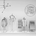 Retail Display Shelves With Mannequin Hanging Clothes Folded Apparel And Neon Sign On Pink Wall