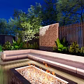 Courtyard Garden With Wooden Deck Seating Area Green Plants Trees And Warm Lighting