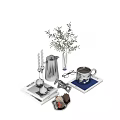 Decorative Ornament Set With Silver Candle Holders Metal Coffee Pot And Green Plant