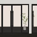 Black Framed Glass Sliding Doors Indoor Scene With Wooden Floor And Potted Plant