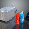 Household Supplies Including Silver Tissue Pack And Colorful Pump Bottles