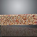 Rice Crispy Treat with Orange and Pink Sprinkles on Black Surface with Reflection