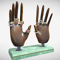 Colorful Gemstone Jewelry Rings Displayed On Wooden Hand Models With Green Base