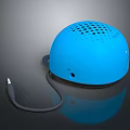 Blue Dome Shaped Computer Speaker With Perforated Design And Audio Cable