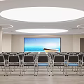 Modern Conference Room With Rows Of Chairs Large Screen And Round Ceiling Lights