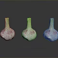 Three Fresh Garlic Bulbs With White Pink Skin And Green Stems On Black Surface