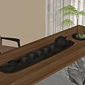 Black Ceramic Tea Set With Teapot And Small Cups On Wooden Tray And Decorative Plant