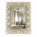Decorative Golden Frame Mirror Reflecting Chandelier And Dining Table With Flower Vase