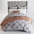Bedroom Bedding Set With Gray Upholstered Headboard Pillows Brown Cushion Patterned Comforter And Knit Blanket