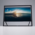 Modern Television With Black Frame Stand Showing Sunset Seaview Cloudy Sky And Sunlight Reflection