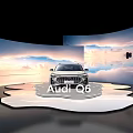 Sleek Audi Q6 Display on Modern Platform with Scenic Sky Backdrop and Reflective Surface