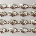 Traditional Patterned Wooden Fans Hanging As Wall Decor In Grid Design
