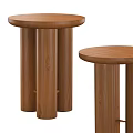 Two Wooden Side Tables With Round Tops And Cylindrical Legs Design