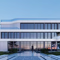 Modern Multi Storey Office Building With Glass Curtain Walls And Landscaped Entrance