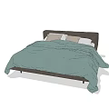 Double Bed With Dark Headboard Green Quilt And Light Brown Pillows