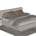 Beige Upholstered Double Bed With Brown Pillows Blanket And White Nightstands On Rug